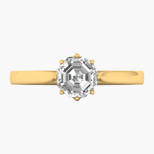 Gold ring with a large diamond on a white background