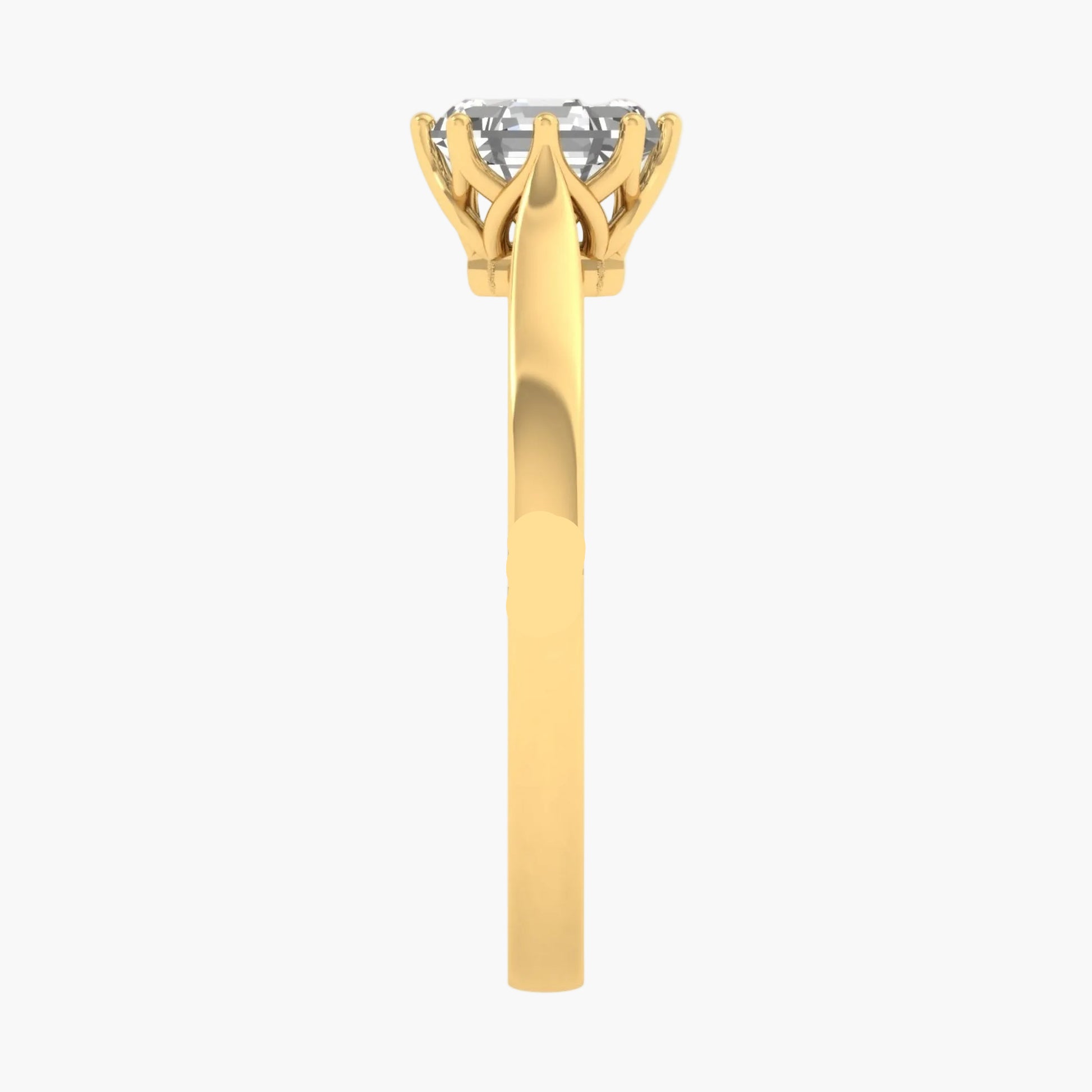 Gold ring with a diamond on a white background