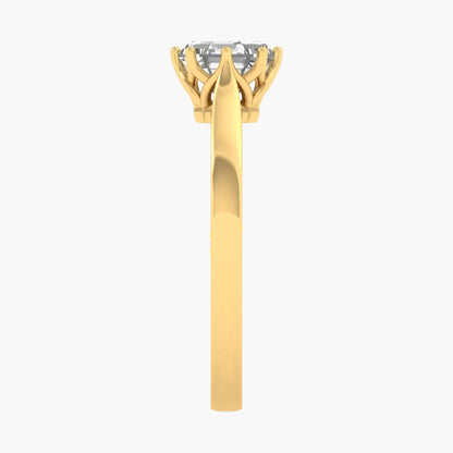 Gold ring with a diamond on a white background