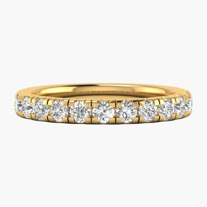 Gold ring with diamonds on a white background