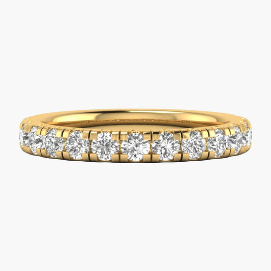 Gold ring with diamonds on a white background