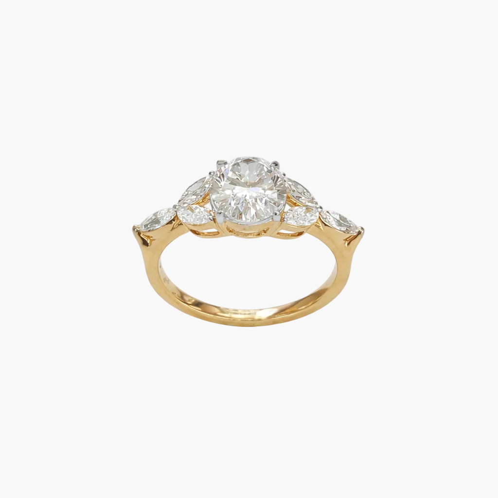 Gold ring with a central diamond and smaller diamonds on a white background