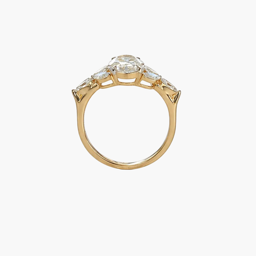Gold ring with a diamond on a white background