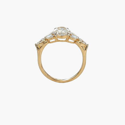 Gold ring with a diamond on a white background