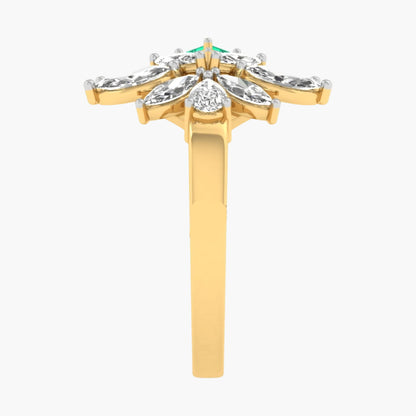 Gold ring with diamonds and a green gemstone on a white background