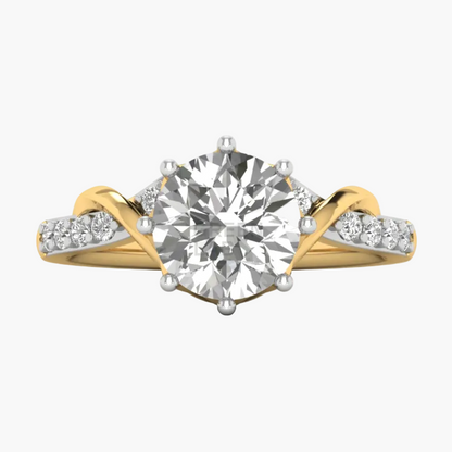 A yellow gold diamond ring with a large round-cut center stone and smaller diamonds set along curved split shanks, shown on a clean white background.
