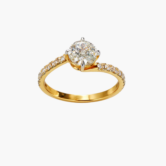 Gold ring with a large diamond and smaller diamonds on the band against a white background