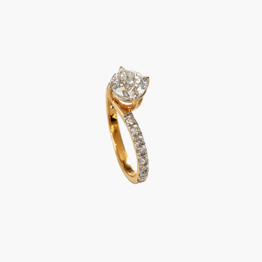 Gold ring with a diamond on a white background