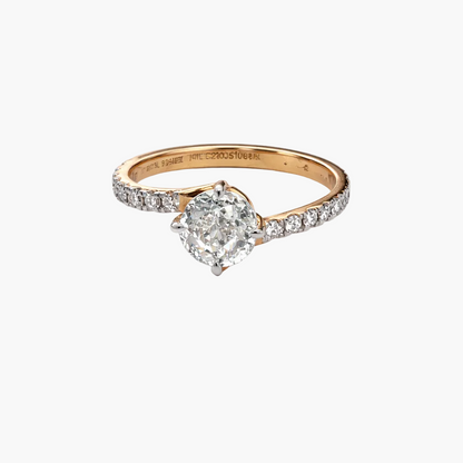 Diamond ring with rose gold band on a white background