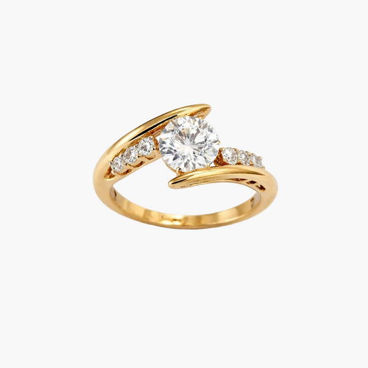 Gold ring with a diamond on a white background