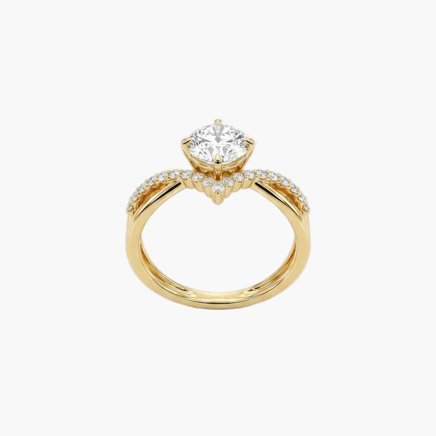 Gold ring with a diamond on a light gray background