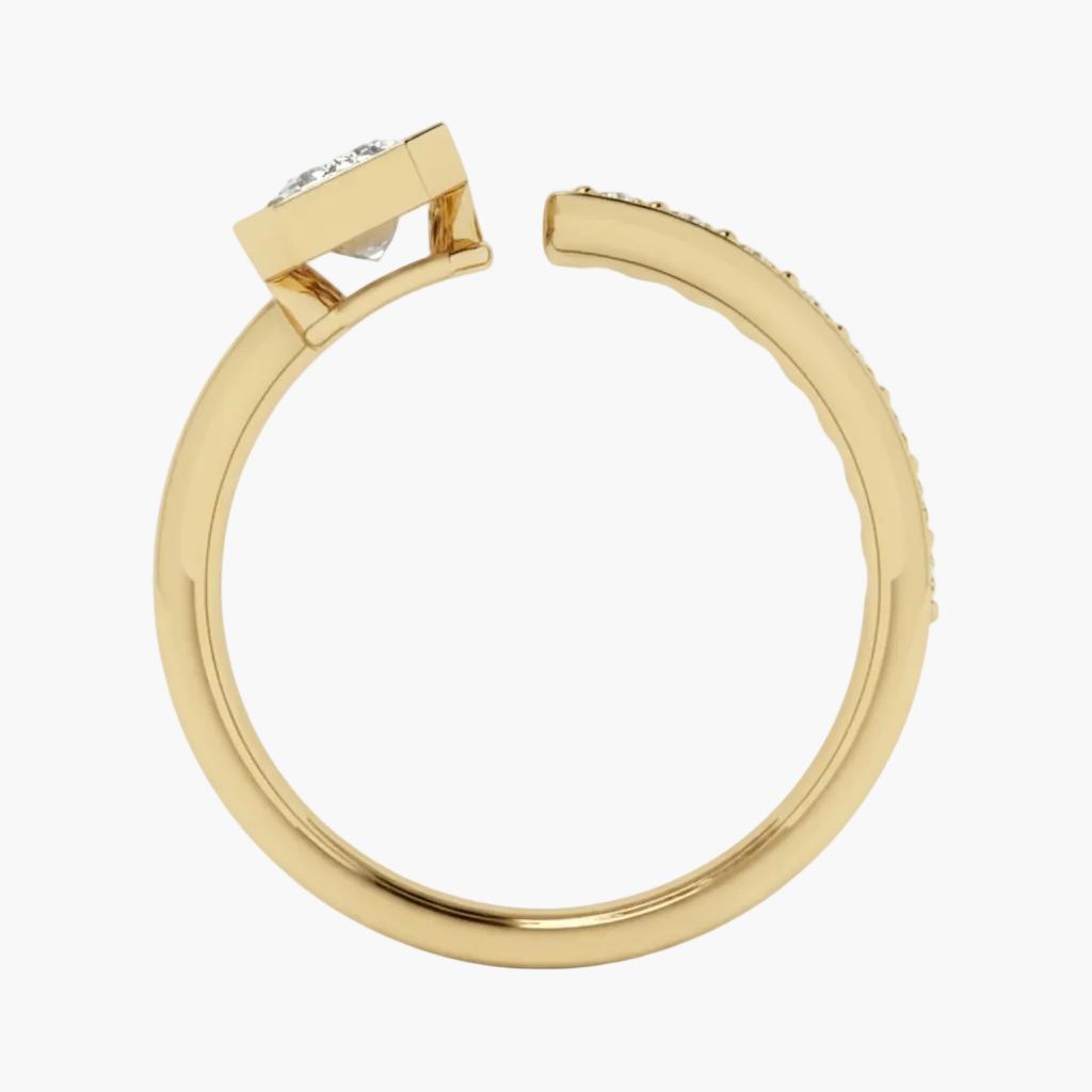 A close-up studio shot of a gold ring with a square-cut clear gemstone in a bezel setting, viewed from the side against a clean white background.