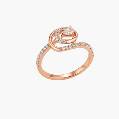 A rose gold ring with a marquise-cut center stone and pavé-set accent stones, shown on a clean white background.