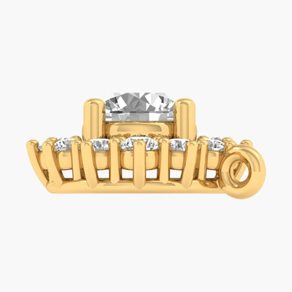 Gold hair clip with clear crystals on a white background