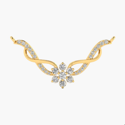 A gold-toned jewelry piece featuring a central floral cluster of clear stones set on a curved, wing-like design with additional small clear stones along the sides, shown on a plain white background.