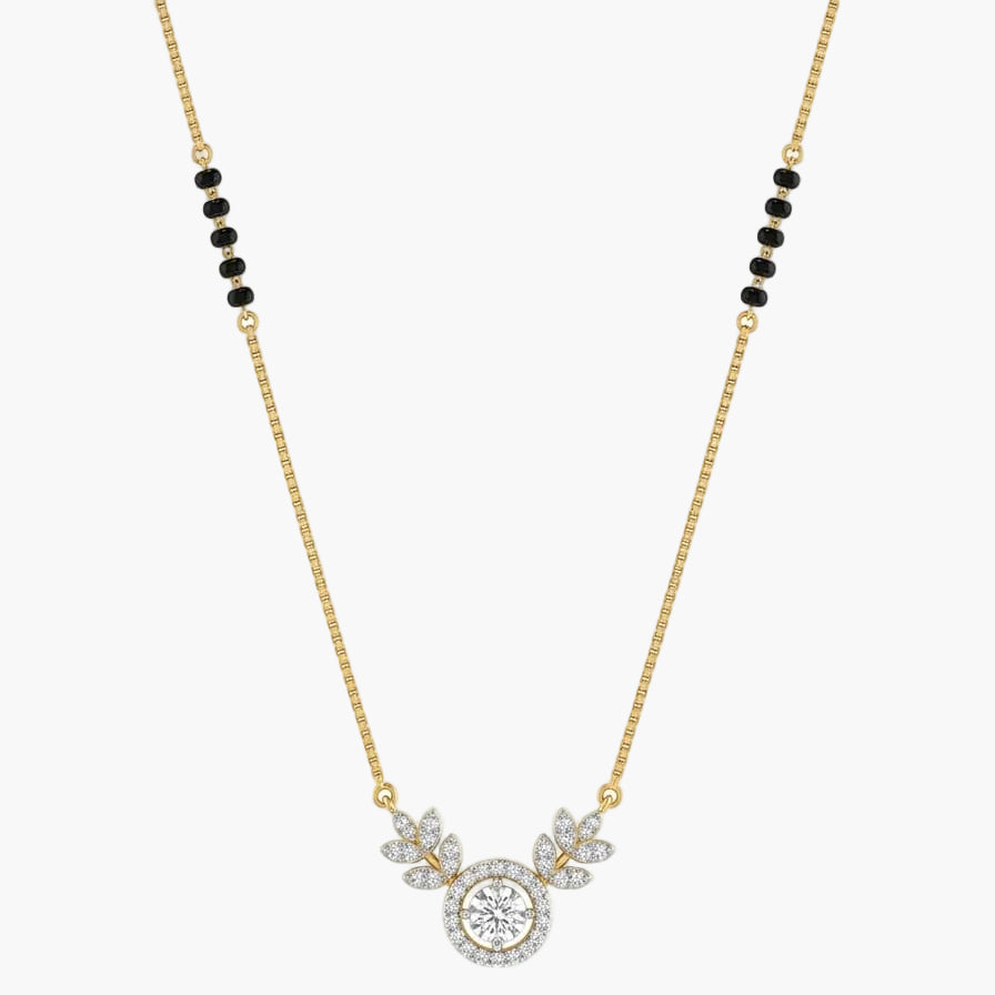 Gold necklace with a round pendant and black beads on a white background