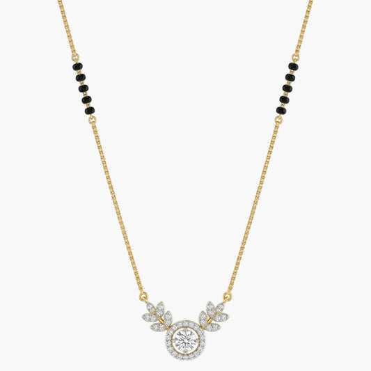 Gold necklace with a round pendant and black beads on a white background