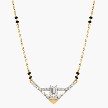 A gold chain necklace with a geometric Art Deco style pendant, featuring clear baguette and round-cut stones, accented with small black beads on the chain, shown against a plain white background.