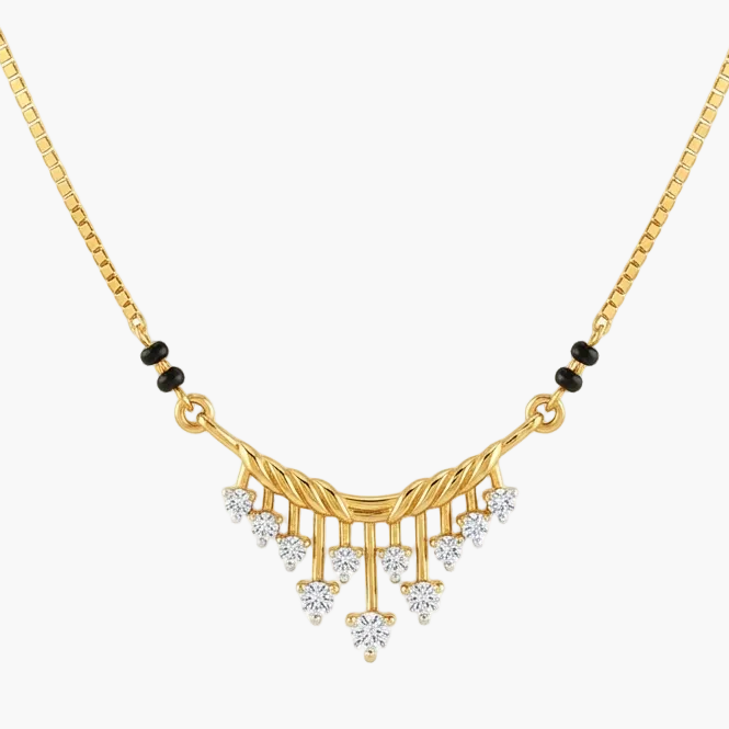 A gold chain necklace with a decorative pendant featuring small black beads and clear stones, shown on a plain white background.
