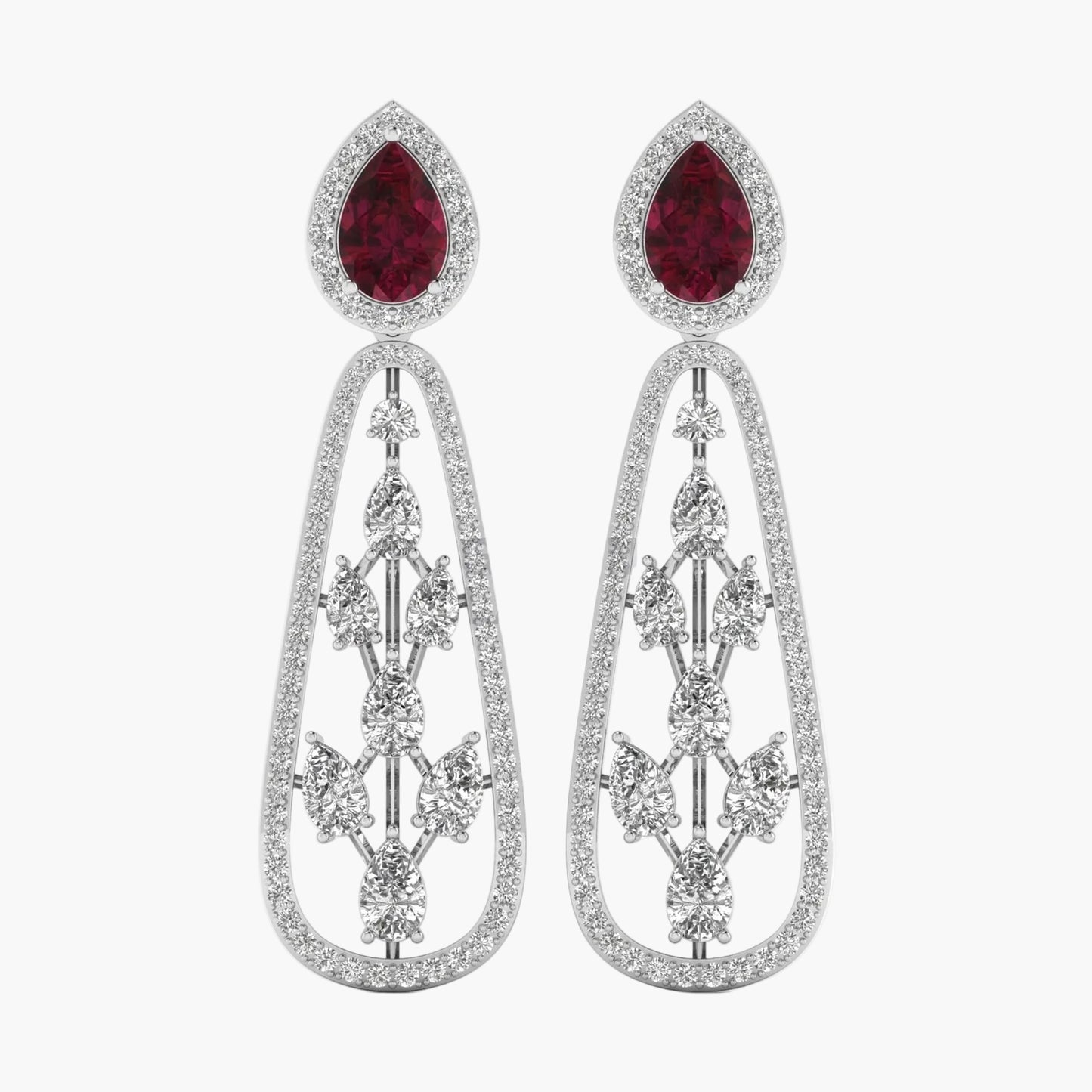 Pair of earrings with red gemstones and silver designs on a white background