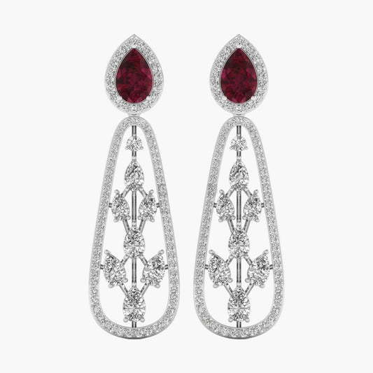 Pair of earrings with red gemstones and silver designs on a white background