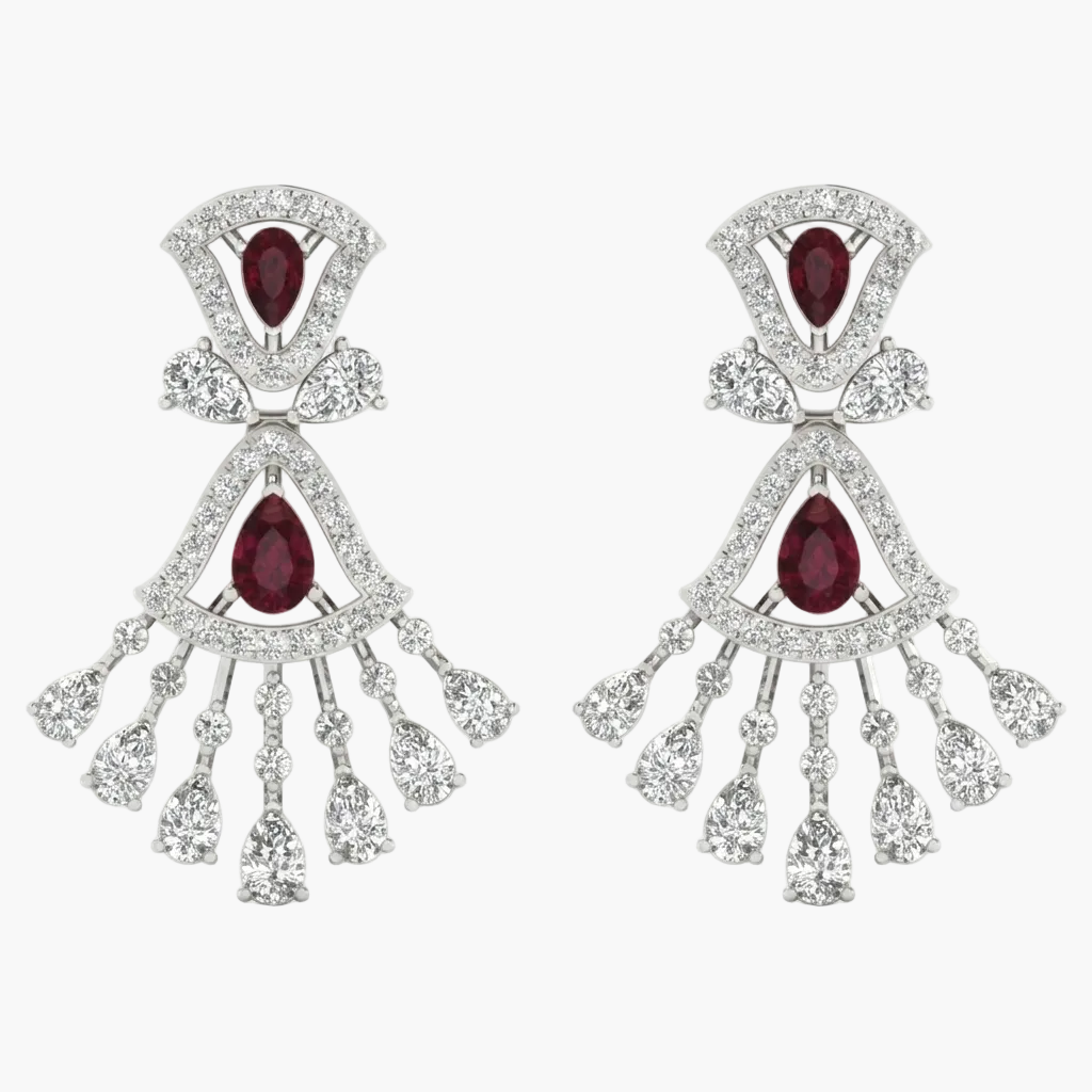 Pair of earrings with red gemstones and diamond-like stones on a white background