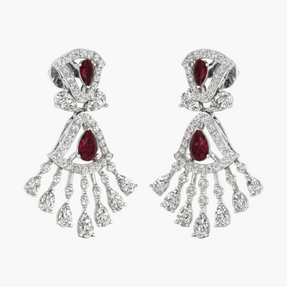 Pair of earrings with red gemstones and silver fringe on a white background