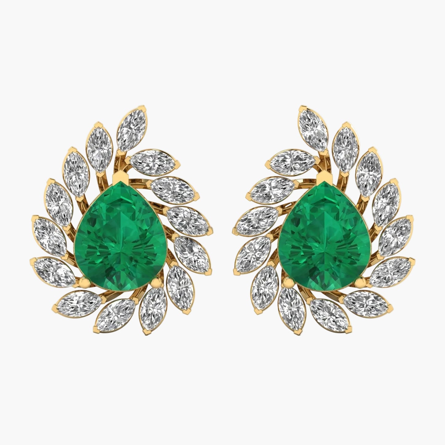 Pair of emerald green teardrop earrings with gold and diamond accents on a white background