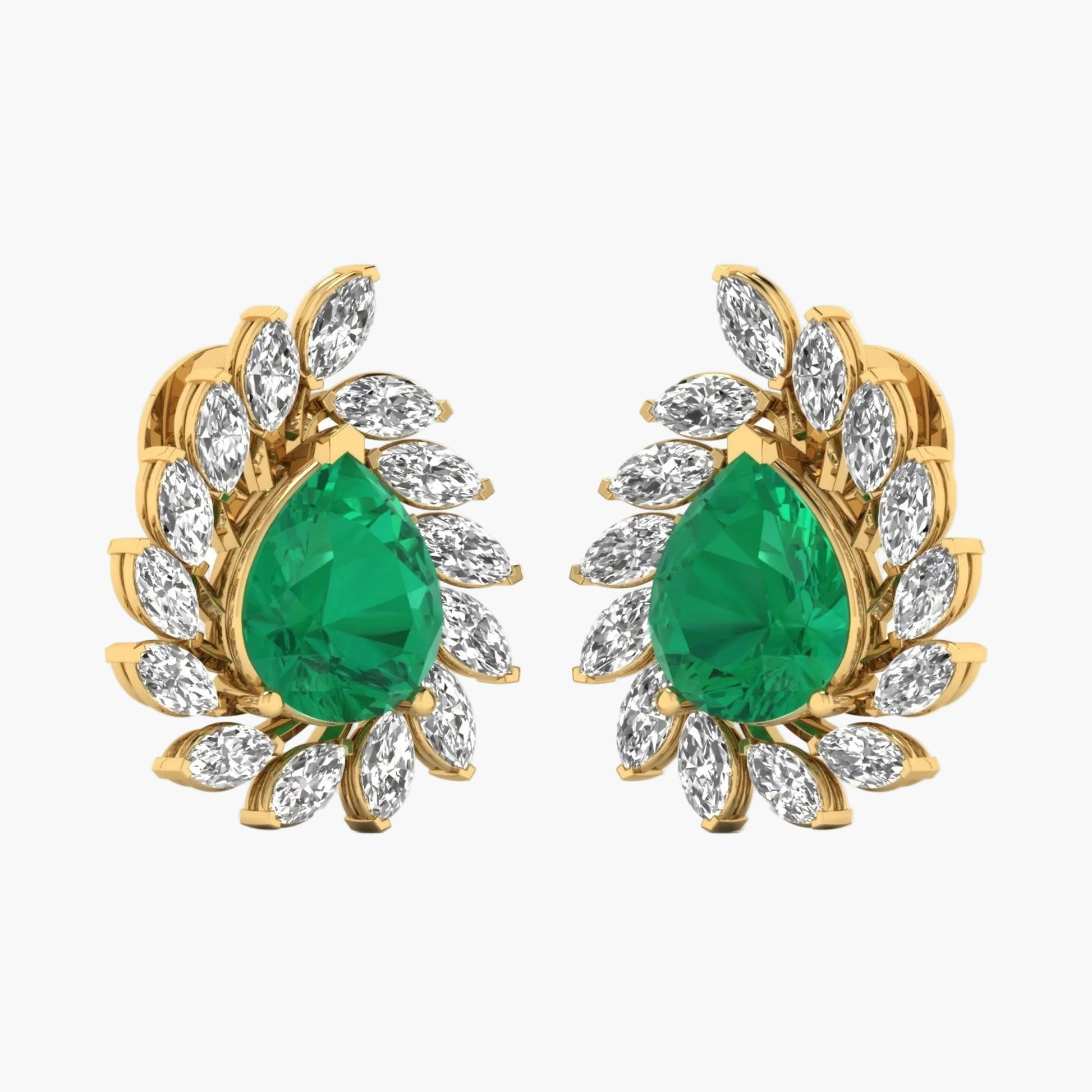 Gold earrings with green gemstones on a white background