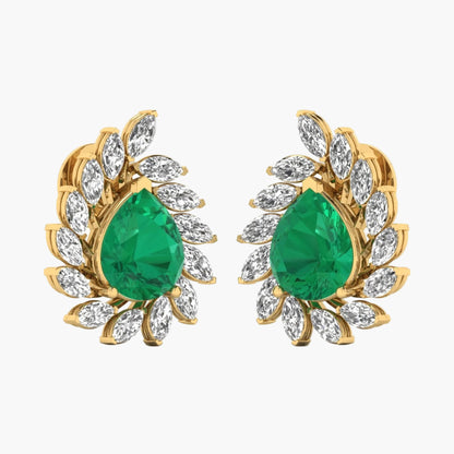 Gold earrings with green gemstones on a white background