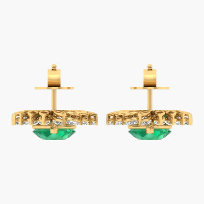 Gold earrings with green gemstones on a white background