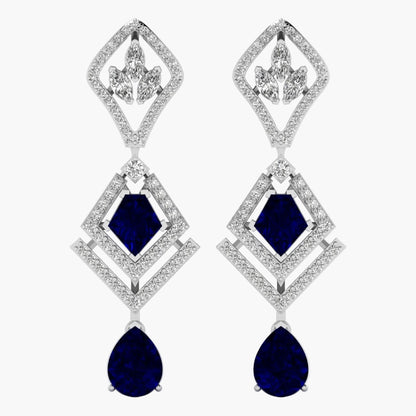 Elegant earrings with blue gemstones and diamond-like stones on a white background