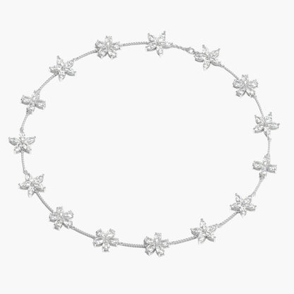 Silver necklace with star-shaped pendants on a white background