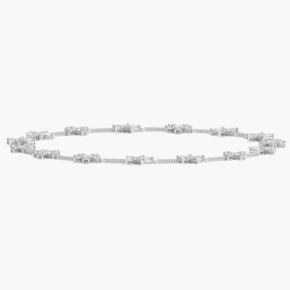 Silver bracelet with baguette-cut diamonds on a white background