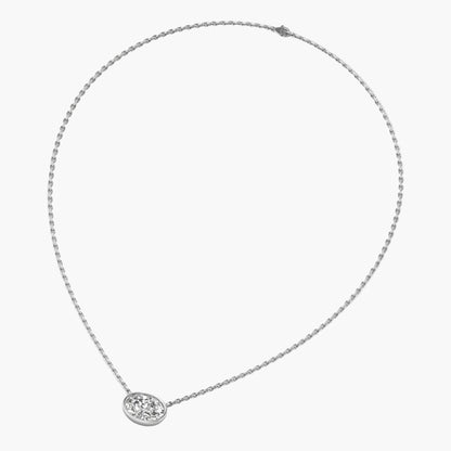Silver necklace with a small round pendant on a white background