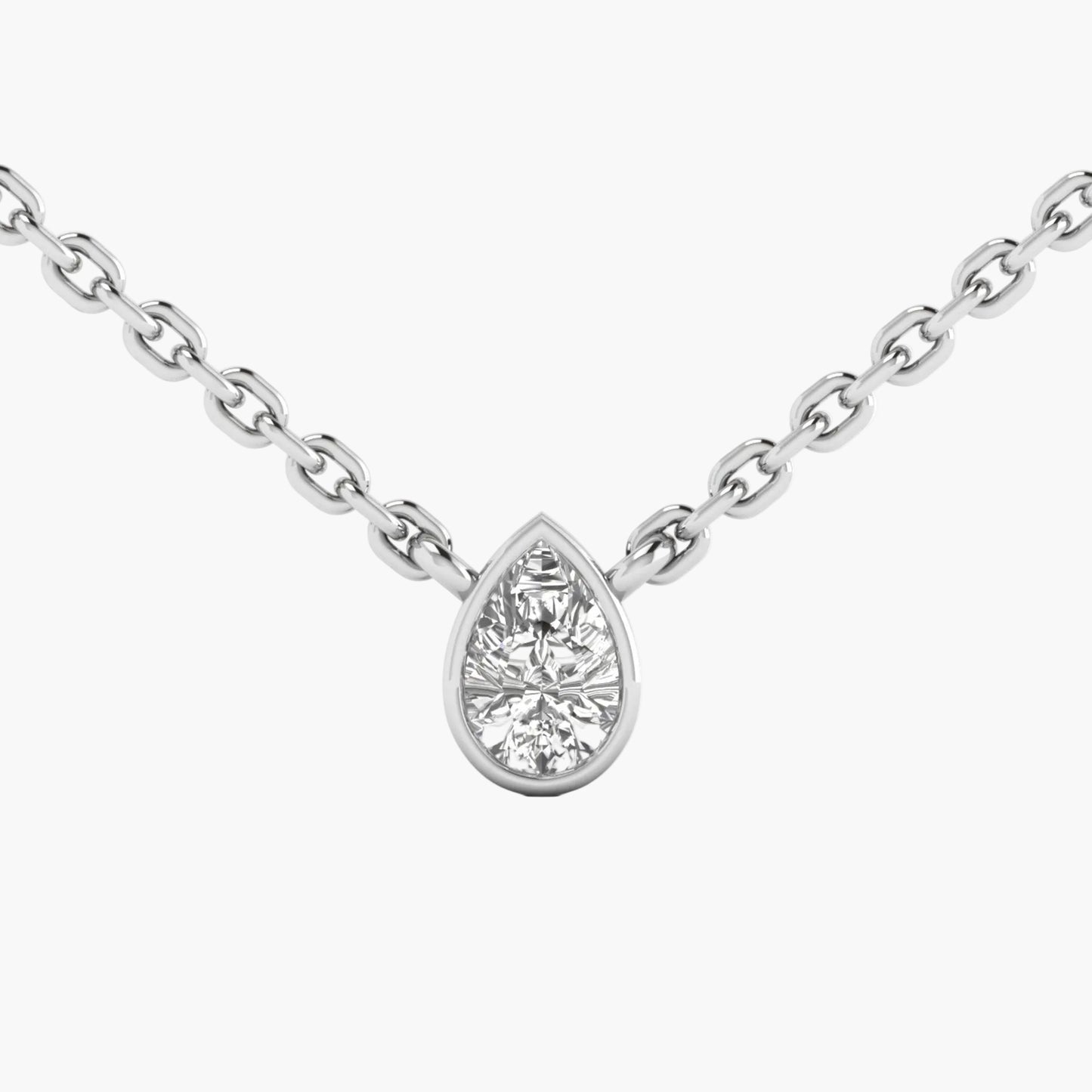 Teardrop-shaped diamond pendant on a chain against a white background