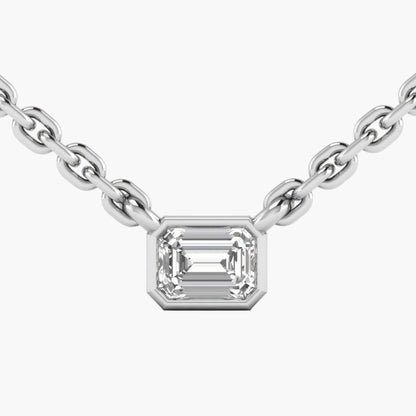Diamond necklace with emerald-cut pendant on a white background