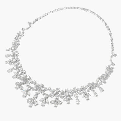 Silver necklace with floral design on a white background