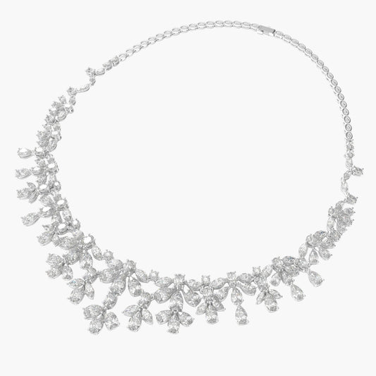 Silver necklace with floral design on a white background