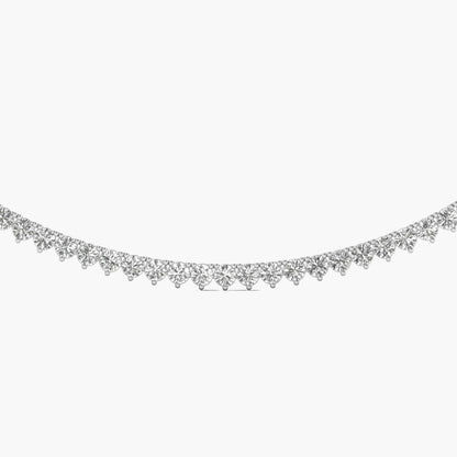 Silver necklace with small beads on a white background