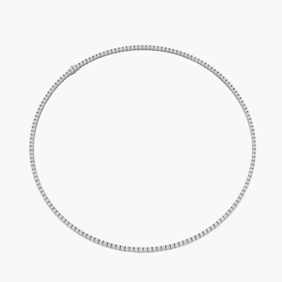 Silver hoop earring on a white background