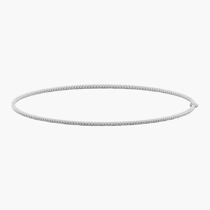 Silver hoop earring on a white background