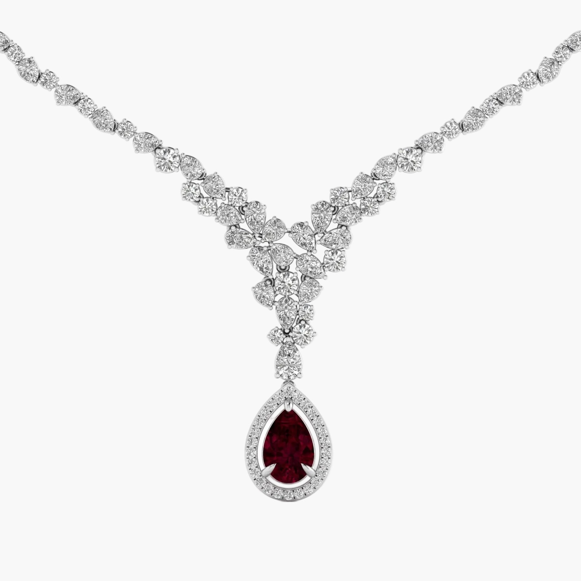 Diamond necklace with a central red gemstone on a white background