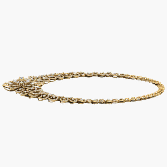 Gold necklace with intricate design on a white background