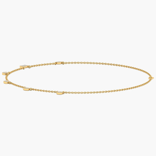 Gold anklet on a white background