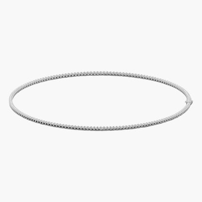Silver hoop earring on a white background
