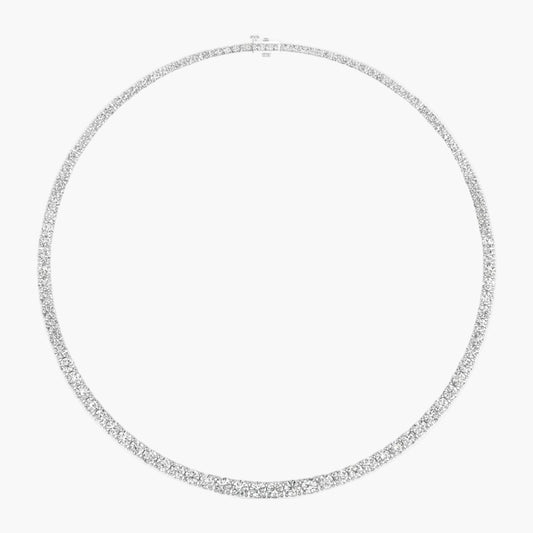 Silver necklace with small diamonds on a white background
