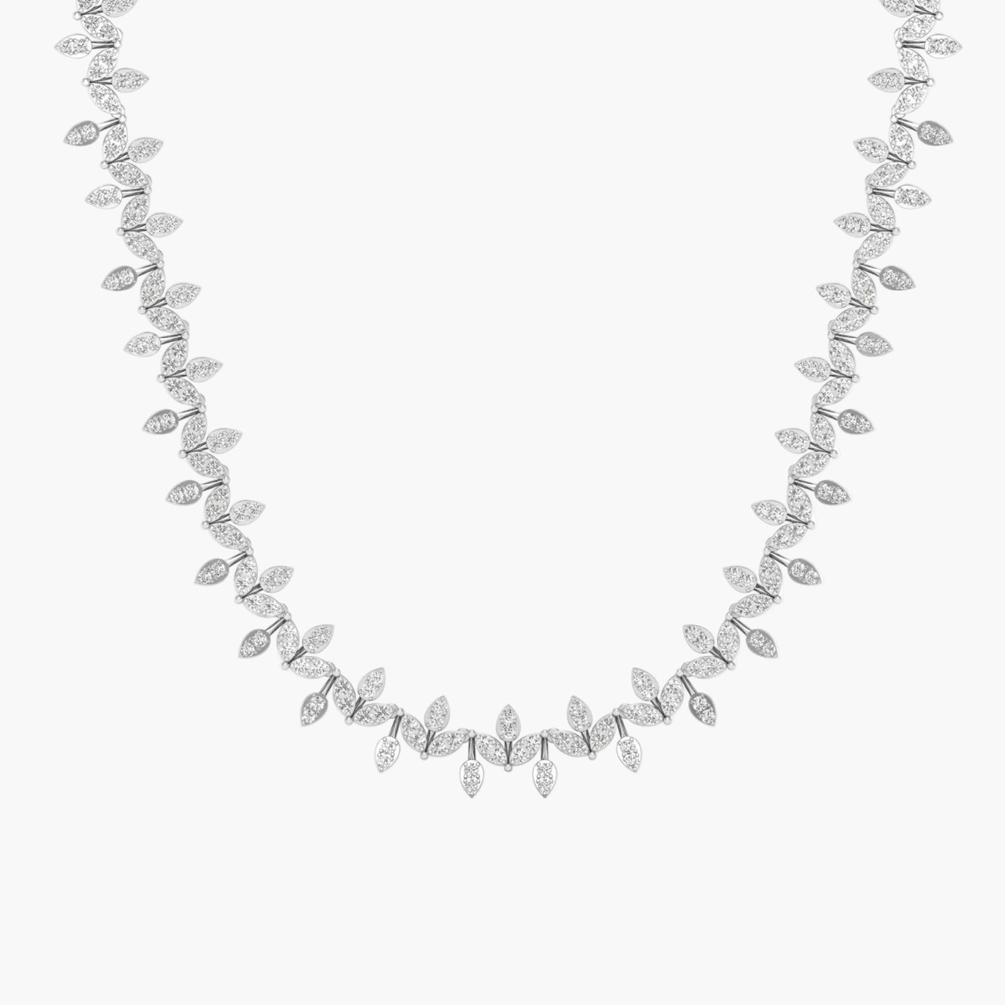 Silver necklace with leaf-like design on a white background