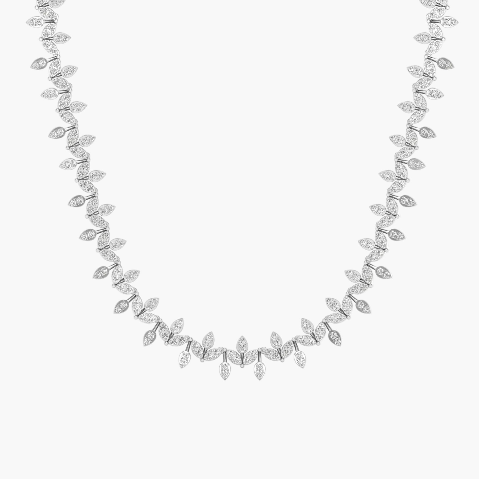 Silver necklace with leaf-like design on a white background