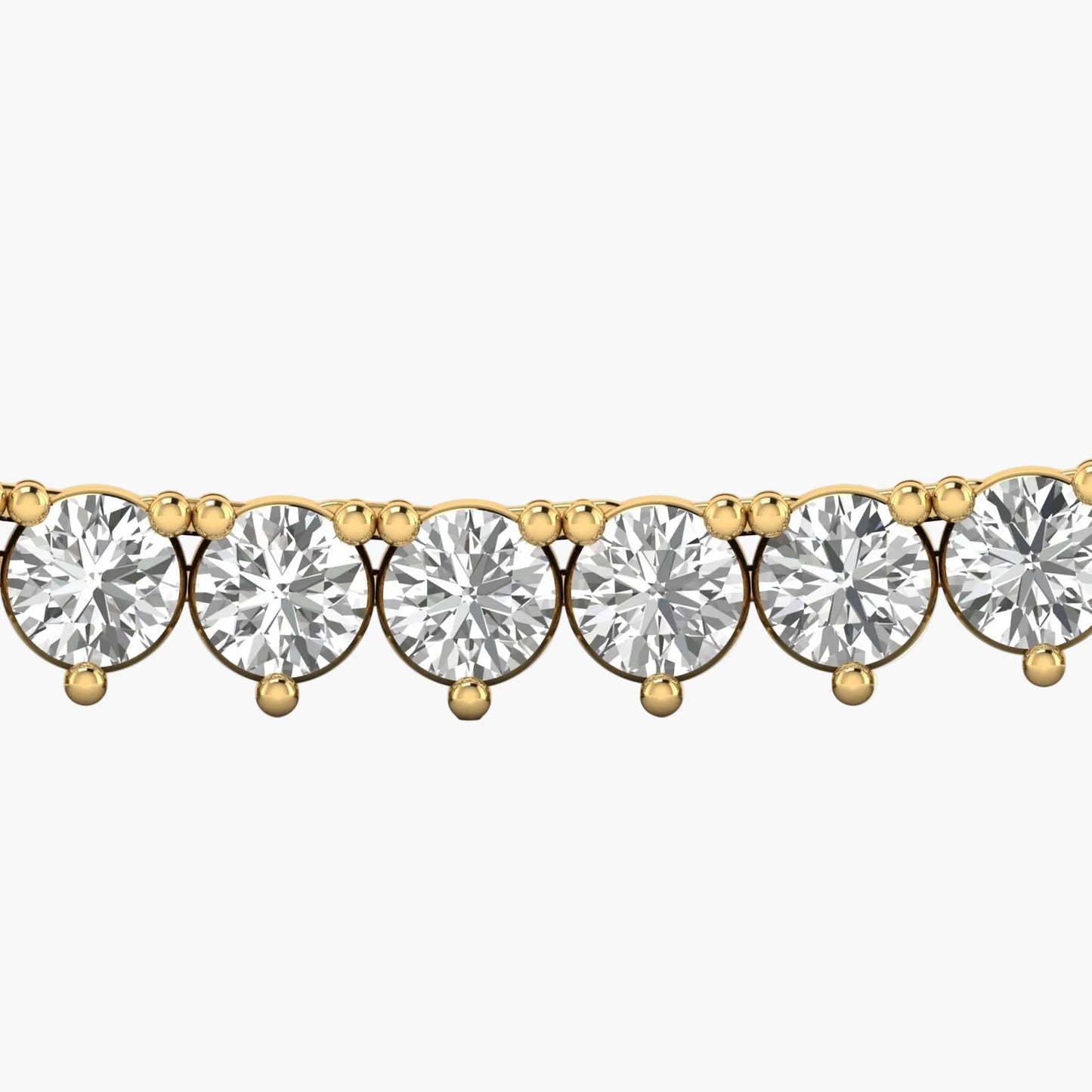 Gold bracelet with clear gemstones on a white background